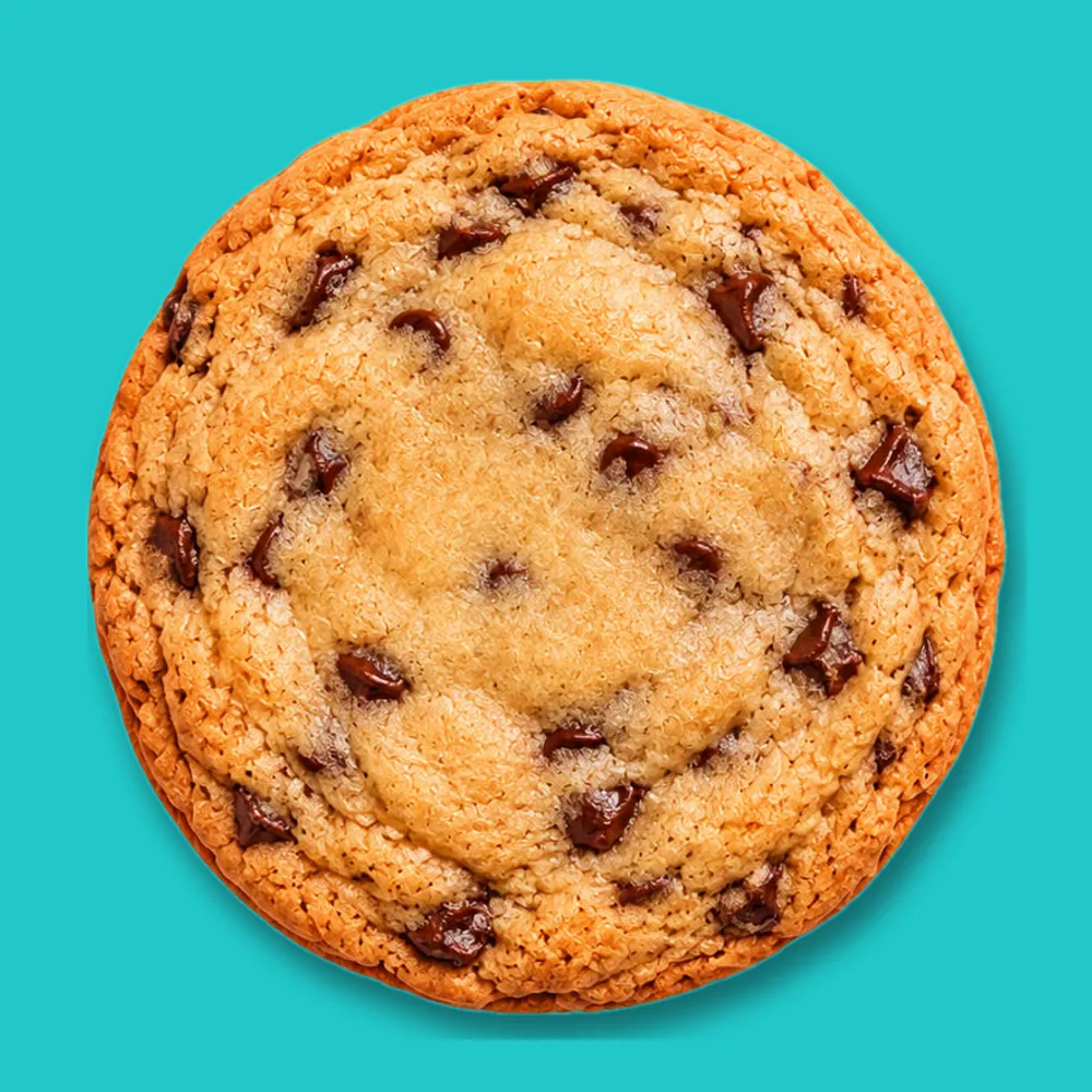 Chocolate chip cookie with golden edges and melted chocolate chips